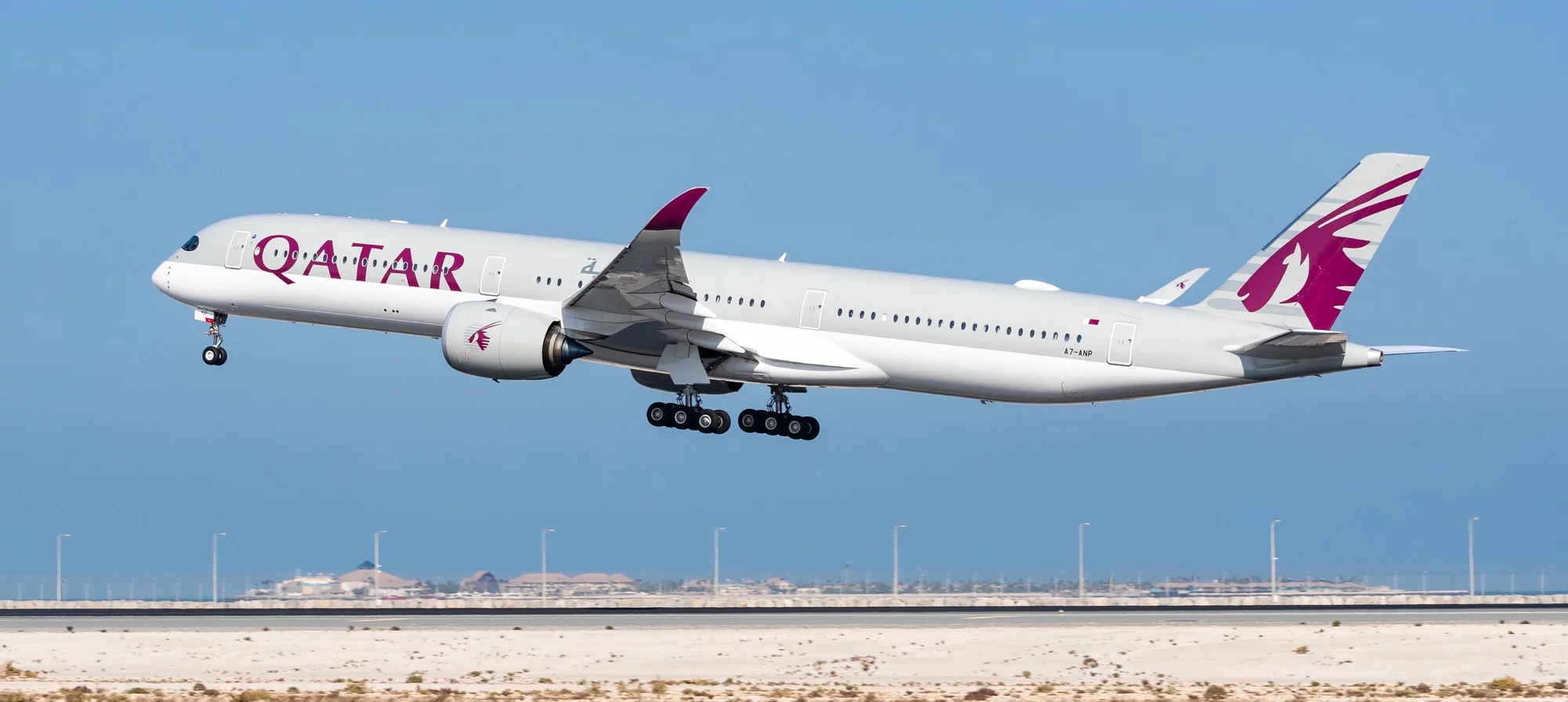 Photograph showing a Qatar A350-1000 taking off