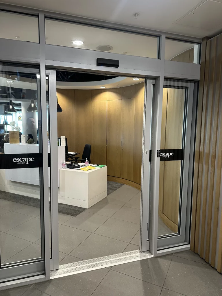 Photograph of the doorway that leads into the Escape Lounge at Manchester Airport, acting as the BA lounge