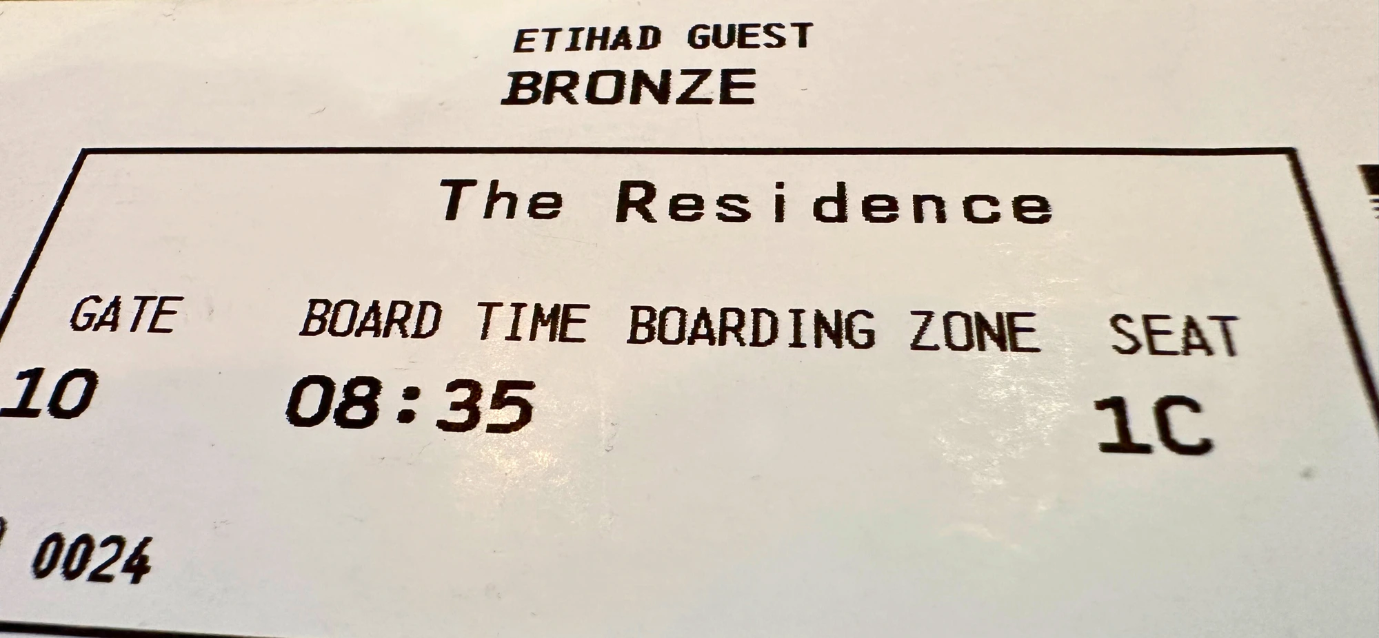 Photograph of a ticket for an Etihad flight that shows the flyer was in The Residence seats