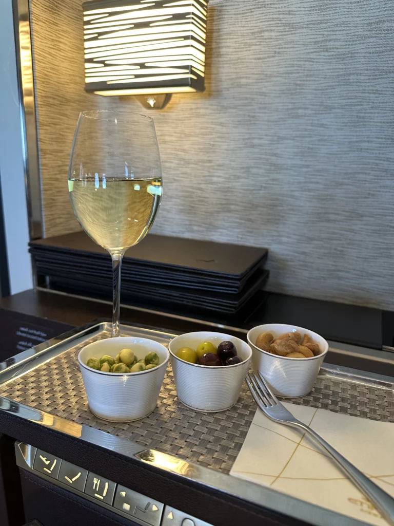 Photograph of a glass of wine within Etihad's The Residence