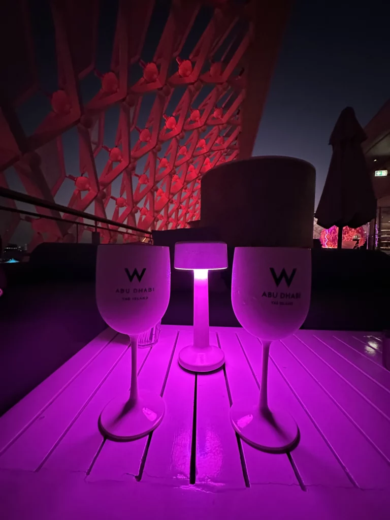 Photograph of two W glasses on the rooftop terrace of the W hotel in Abu Dhabi