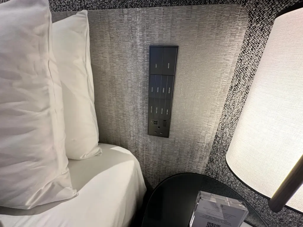 Power and light switches next to the bed Power and light switches next to the bed