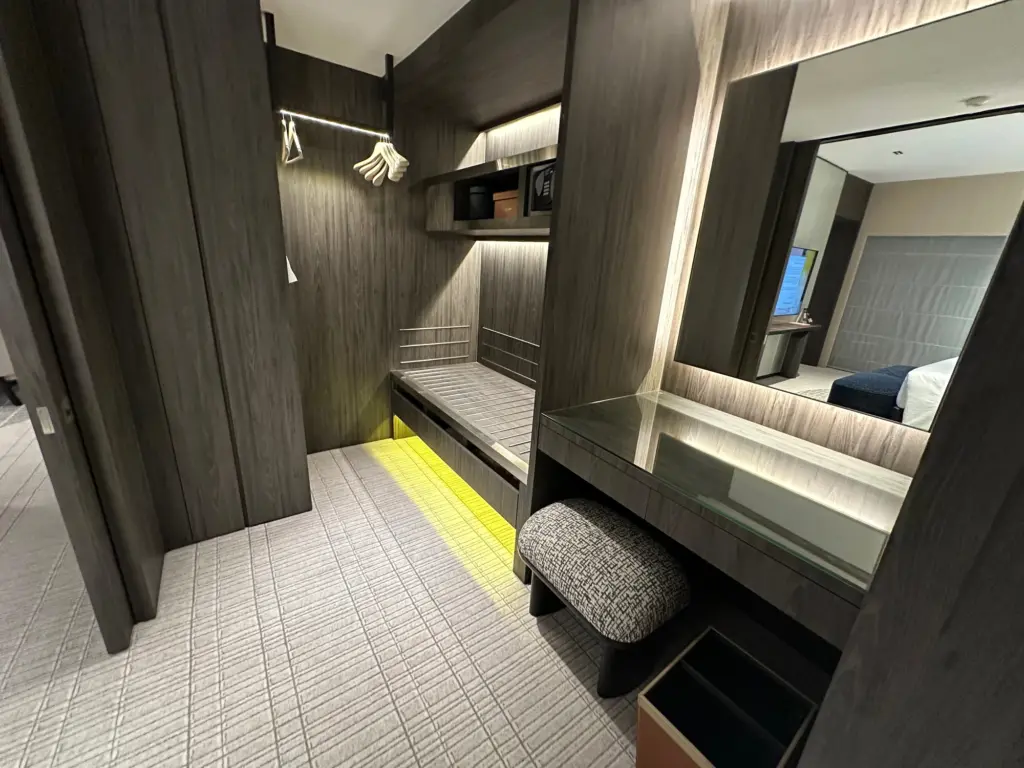 The dressing table along with luggage storage and a wardrobe The dressing table along with luggage storage and a wardrobe