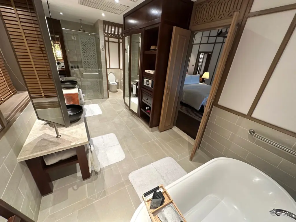 The upstairs bathroom with a full sized bath spacious shower and separate toilet room