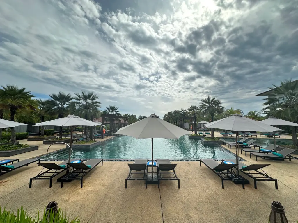 Seating the pool and beyond that the beach