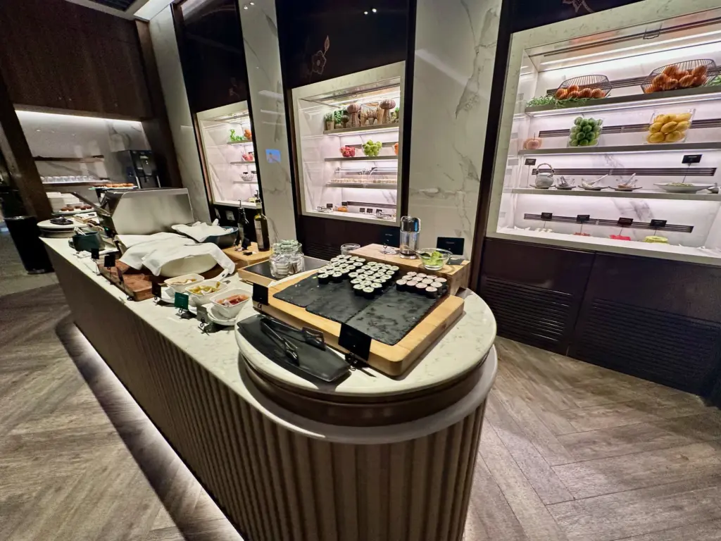 The cold food options in the lounge include sushi The cold food options in the lounge include sushi