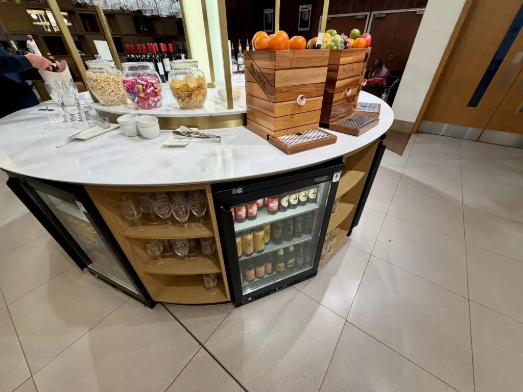 The self service bar counter with alcoholic and soft drinks The self service bar counter with alcoholic and soft drinks