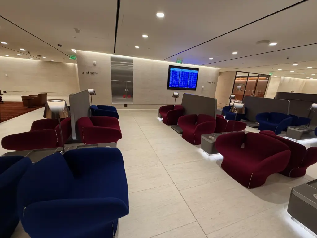 Comfy seating and charging ports in the main body of the lounge