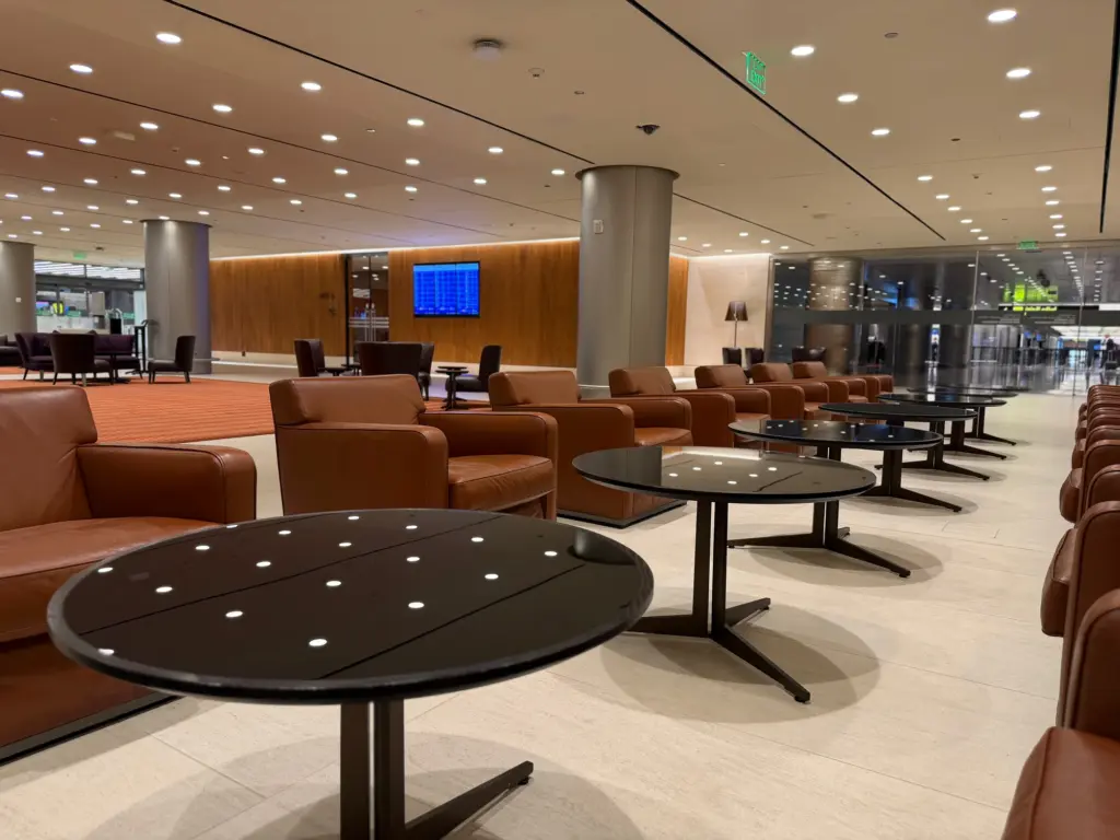 Comfortable seating next to the food area with the lounge entrance in the background to the right