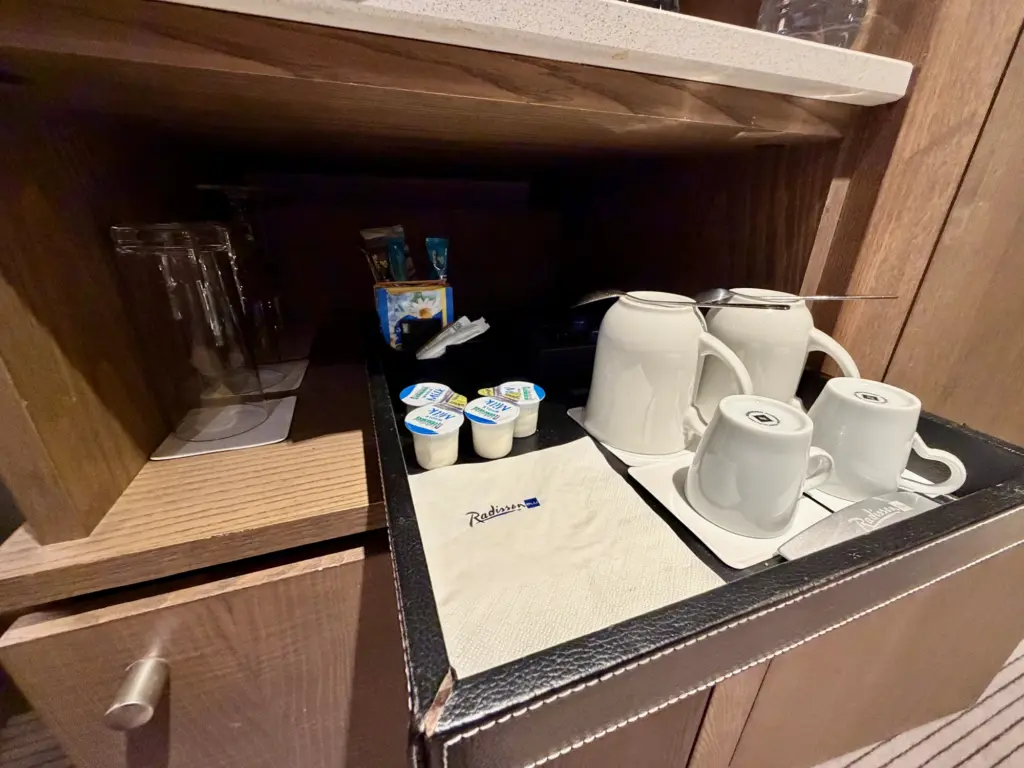 A generous selection of cups and glasses with more glasses in the bathroom A generous selection of cups and glasses with more glasses in the bathroom