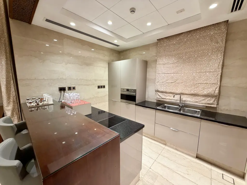 A photograph of the kitchen inside a one bedroom villa in the Al Messila resort. 