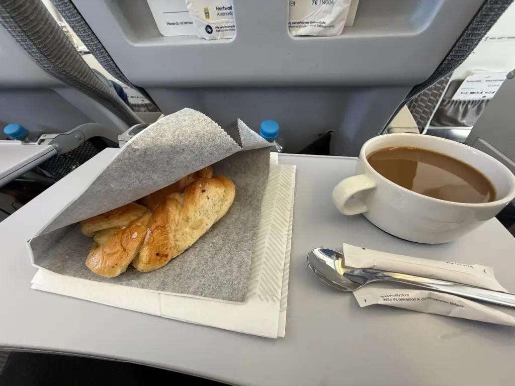The perfect end to the food service a warm cinnamon bun and a coffee The perfect end to the food service a warm cinnamon bun and a coffee