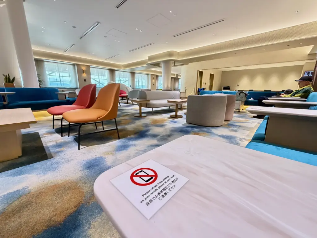The quiet seating area with useful side tables and a no mobiles sign The quiet seating area with useful side tables and a no mobiles sign