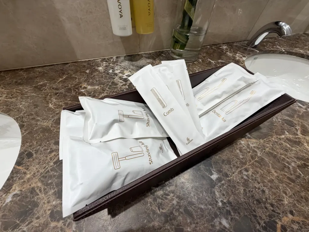Amenities you can use within the bathrooms A photograph of an amenities basket inside the bathroom of an Emirates First lounge