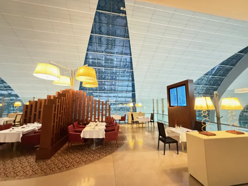 The formal dining space which sits on a balcony thats open to the main terminal Photrograph of the Emirates First Class dining space
