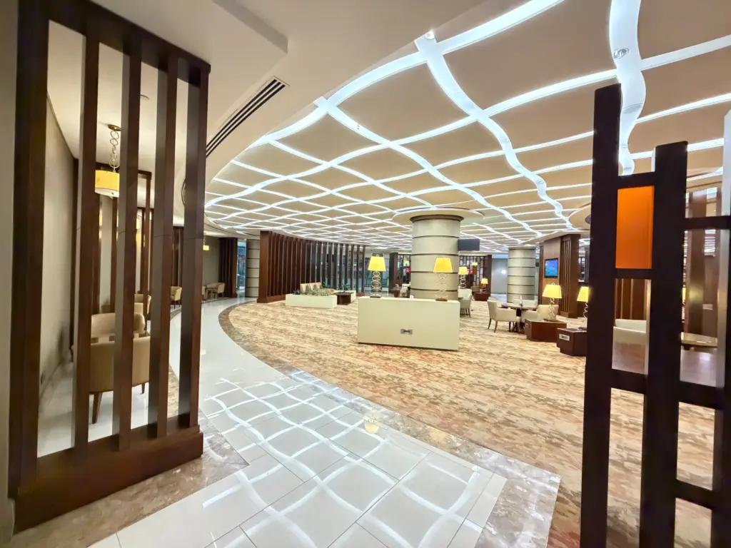 The entrance to the large bar and self service food area at the far right of the lounge Photograph of the bar area at the Emirates First lounge in Dubai