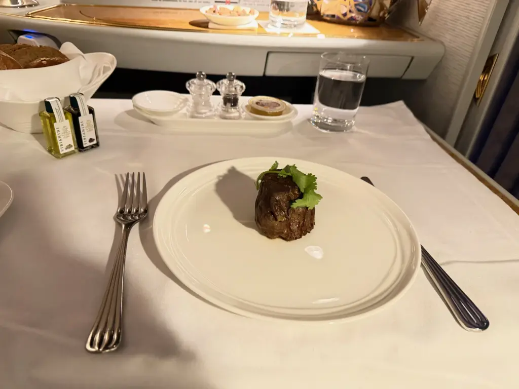 My steak Dont hate me for it being well done Photograph of a cooked Fillet Steak in an Emirates First suite on their A380