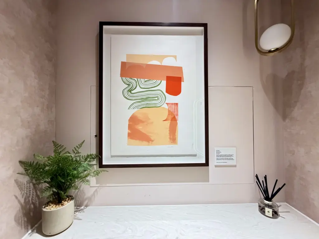 A photograph of artwork inside a toilet cubicle