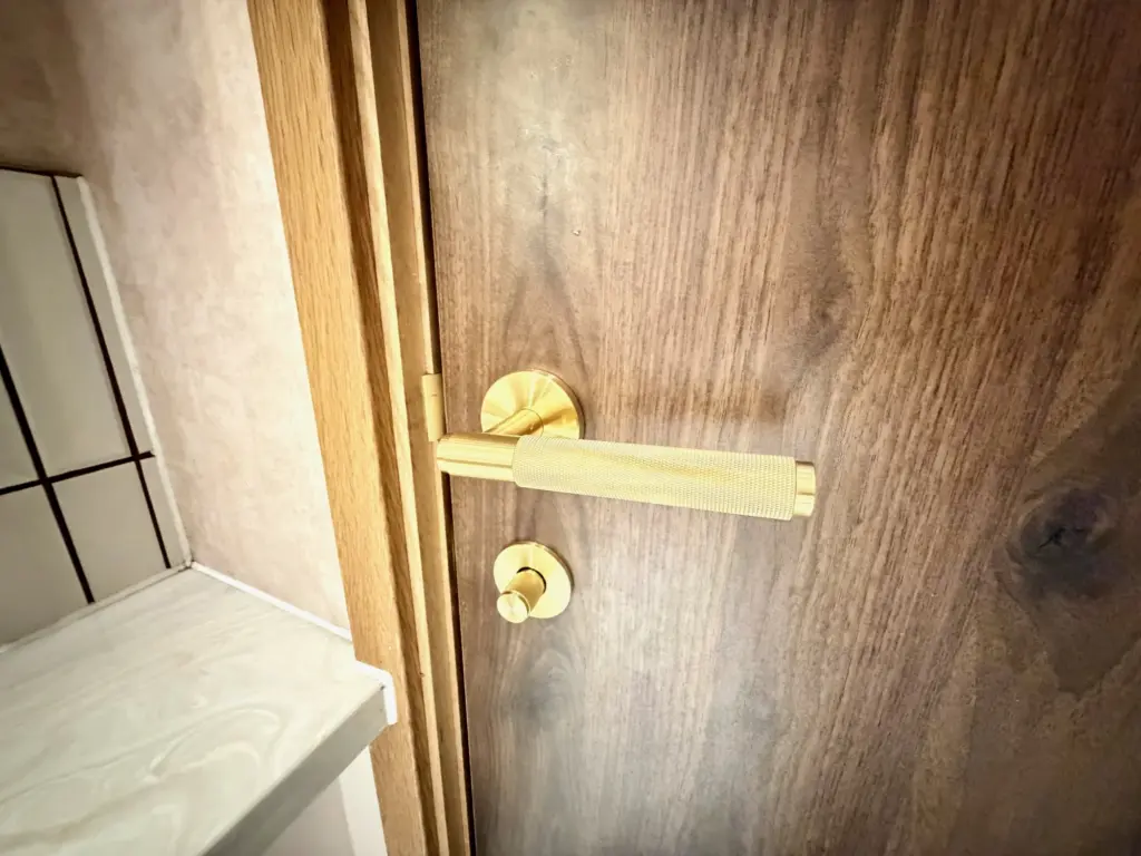 A photograph of a door handle in the bathrooms of the Executive lounge at Manchester Airport