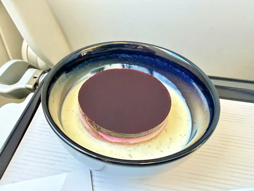 The dessert an Elderflower tartlet A photograph of a desert on a Lufthansa short haul business class flight