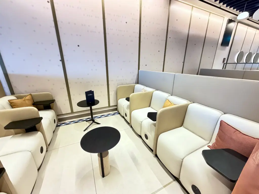 A photograph of individual seating with tables