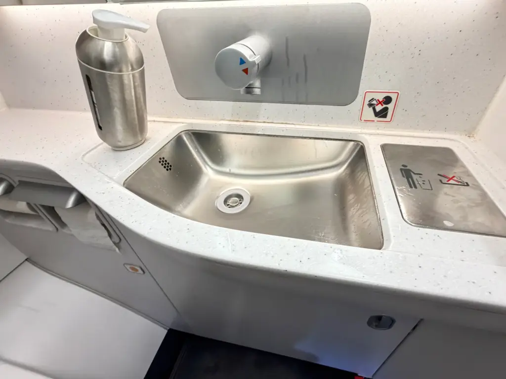 The no frills sink and minimalist toiletries A photograph of a bathroom sink inside a Lufthansa A320