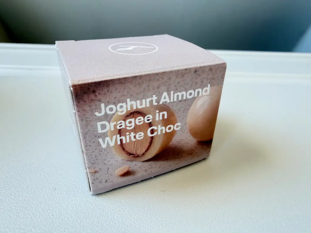 A small chocolate ended the meal service A photograph of a small, single box of chocolates in Lufthansa's business class