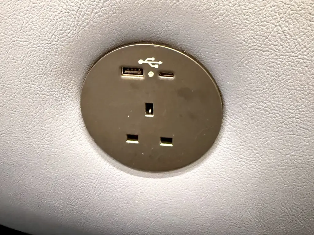 A photograph of a charging port inside the lounge