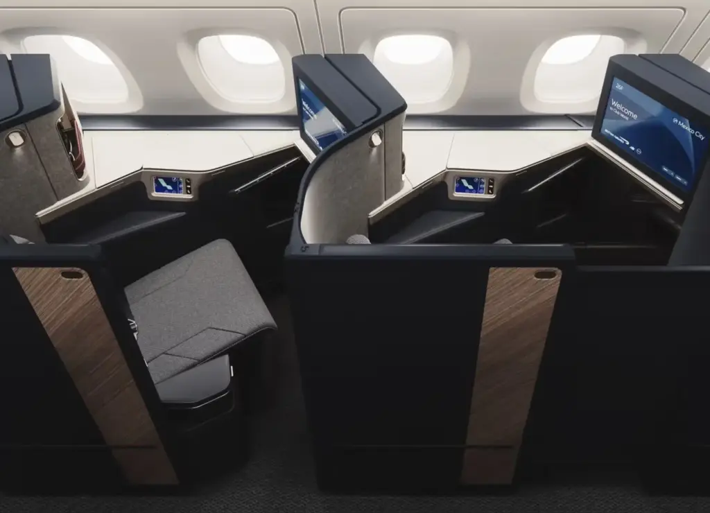 The refreshed Club Suite with darker walls and a lighter tabletop A photograph of the new BA A380 Club Suite